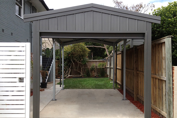Single carport with gable infill in dark grey steel