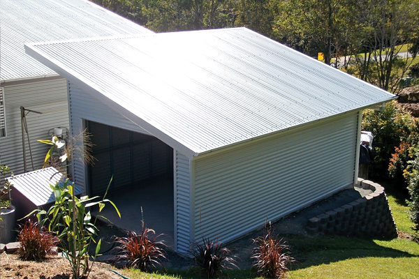 Skillion roof shed with single roller door and angled roof pitch