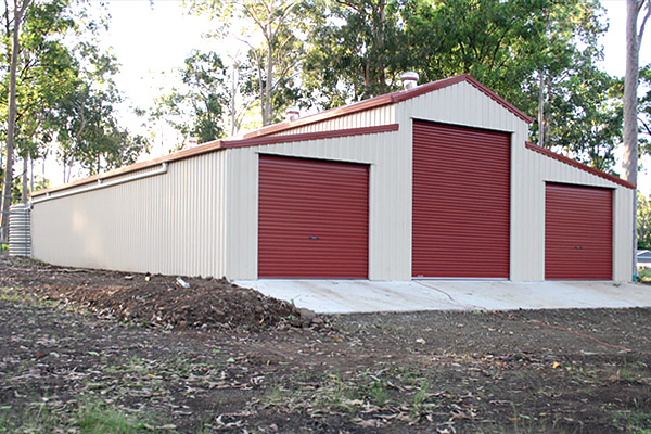 Three Roller door American Barn in Classic Cream with Manor Red Doors and Trim