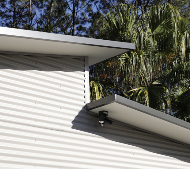 Corrugated cladding on a skillion shed with lean-to